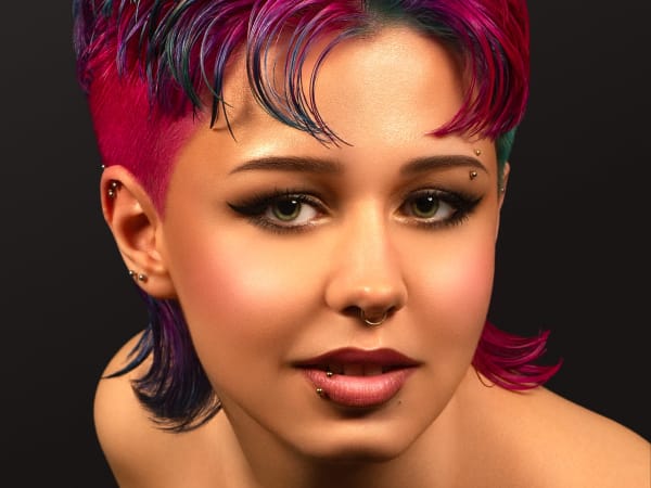 A model with a pink pixie cut
