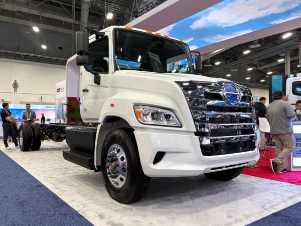 White electric Hino truck on show floor