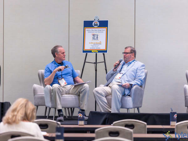 Curt Macysyn hosts a live episode of The Bus Stop podcast featuring Marty Savino of School-Radio during the 2026 NSTA Annual Meeting & Convention.