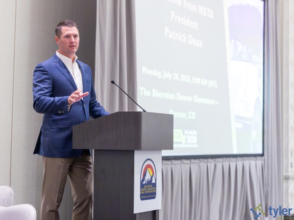 NSTA President Patrick Dean welcomes attendees during the opening general session of the 2026 National School Transportation Association Annual Meeting & Convention in Denver.