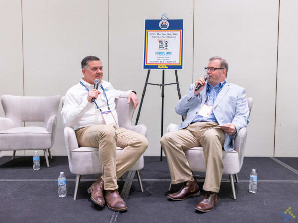 Curt Macysyn interviews Robert Jacobus of School Bus Logistics during a live recording of The Bus Stop podcast at the 2026 NSTA Annual Meeting & Convention.
