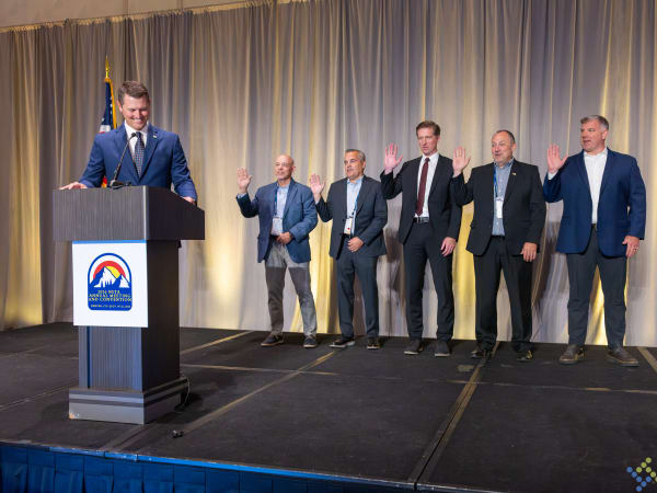 Newly re-elected NSTA officers raise their right hands during the installation ceremony at the association's Awards and Installation Dinner in Denver.