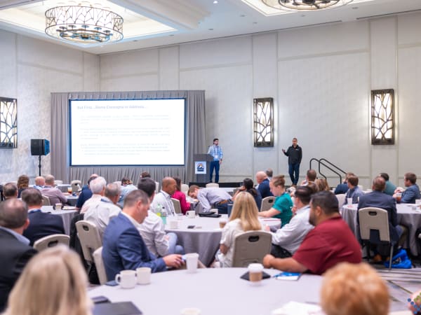 Attorneys Brian Hill and Matt Jandrisavitz present on rising transportation costs, inflation, insurance, and contracting challenges during an educational session at the 2026 NSTA conference.