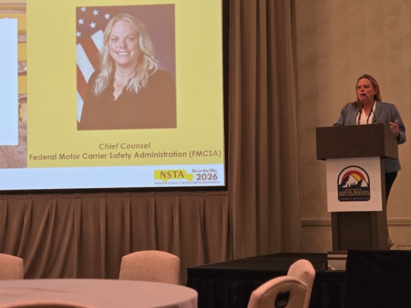Rebecca Pettit, chief counsel for the Federal Motor Carrier Safety Administration (FMCSA), delivers a federal policy update during a luncheon session at the 2026 NSTA Annual Meeting & Convention, discussing agency priorities, CDL integrity, and highway safety initiatives.