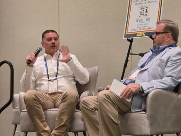 Curt Macysyn interviews Robert Jacobus of School Bus Logistics during a live recording of The Bus Stop podcast at the 2026 NSTA Annual Meeting & Convention.