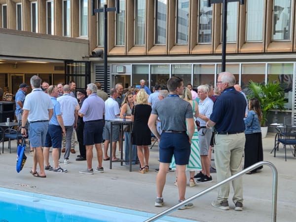 Attendees gather around the Sheraton Denver Downtown rooftop pool during the welcome reception, networking and reconnecting to kick off the 2026 NSTA Annual Meeting & Convention.