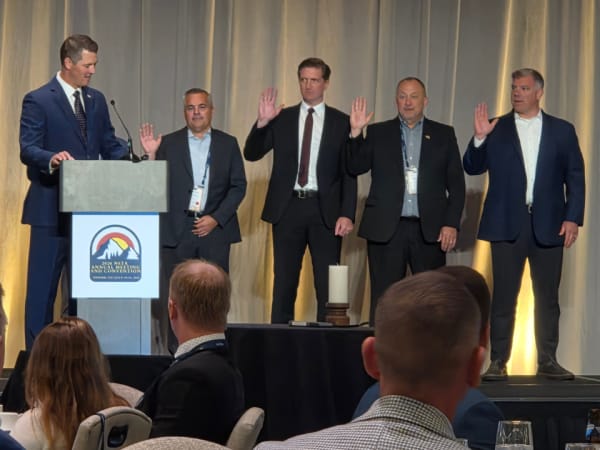 Newly elected NSTA officers raise their right hands during the installation ceremony at the association's Awards and Installation Dinner in Denver.
