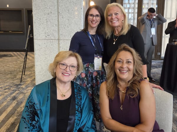 School Bus Fleet Executive Editor Amanda Huggett poses with Alexandra Robinson, NAPT President and CEO Molly McGee Hewitt, and AMF Bruns of America National Account Manager Maritza Valentin during the cocktail reception at the 2026 NSTA Annual Meeting & Convention in Denver.