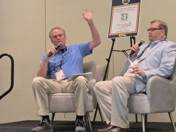 Curt Macysyn hosts a live episode of The Bus Stop podcast featuring Marty Savino of School-Radio during the 2026 NSTA Annual Meeting & Convention.