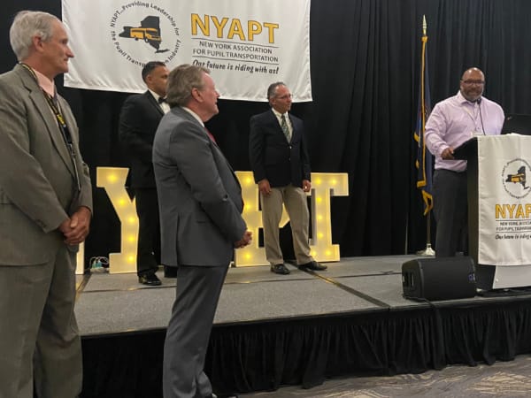 D'Allah Laffoon, transportation director for Liverpool Central School District, speaks during an awards presentation at the 2026 NYAPT conference.