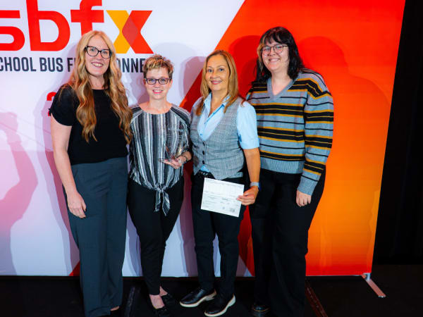 Kelli Goterba poses with her 2026 Special Needs School Bus Driver of the Year award alongside Jennifer Durno, AMF Bruns’ Maritza Valentin, and School Bus Fleet’s Elora Haynes.