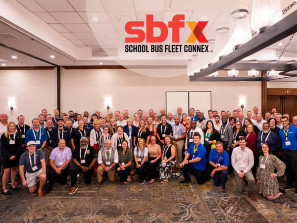 About 100 school transportation operators, suppliers, speakers, and staff gather for a group photo at the 2026 School Bus Fleet ConneX in Scottsdale, Arizona.