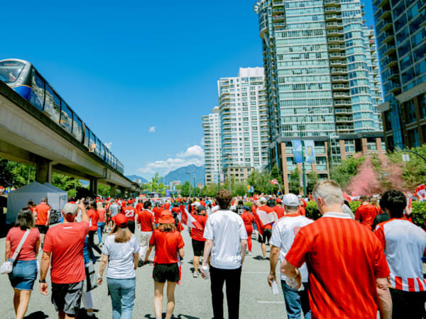 World Cup fans gather beneath a TransLink SkyTrain line in Vancouver.