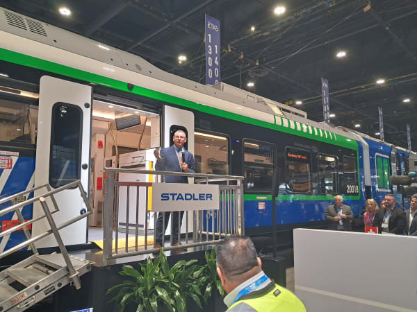 Metra's Jim Derwinski in front of the agency's Stadler electric railcar