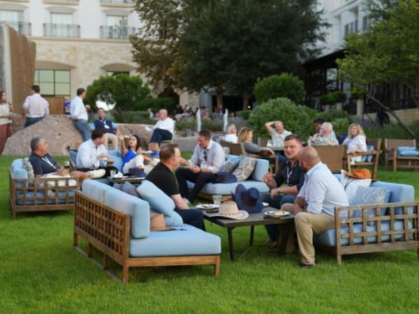 Networking on couches on the lawn. 