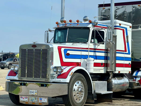 Classic Peterbilt truck with red, white, and blue color scheme
