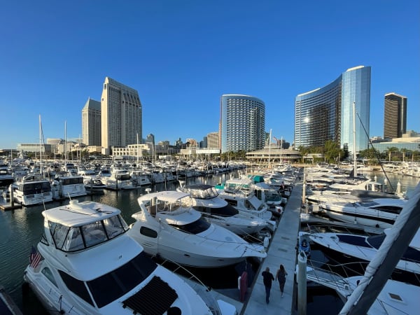 boats in harbor with San Diego skyline in background