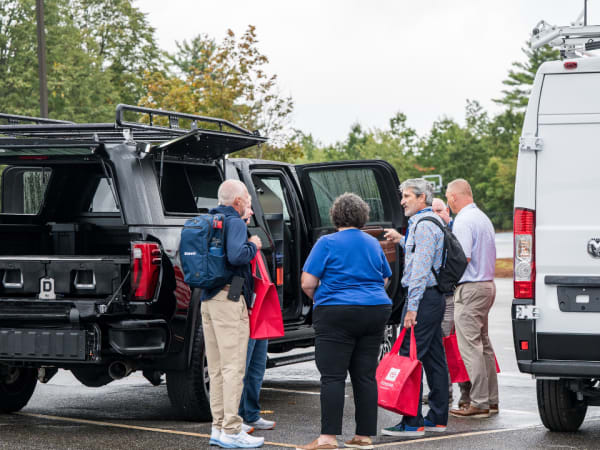 Attendees look into upfit pickup truck. 