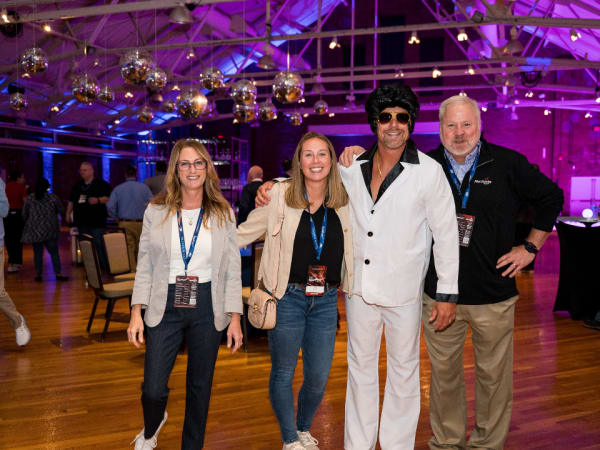 Attendees pose at closing dance party. 