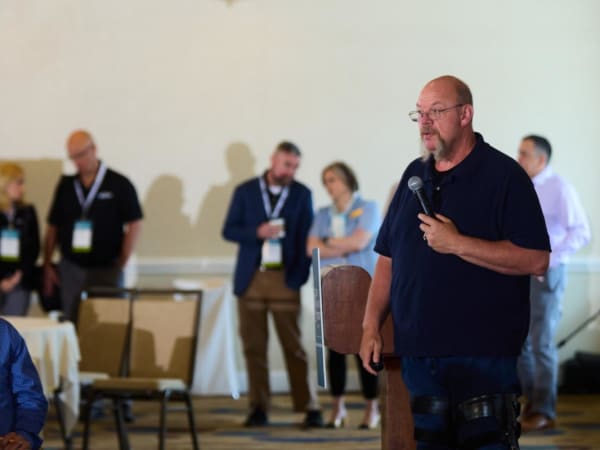 Man with microphone delivers a seminar. 