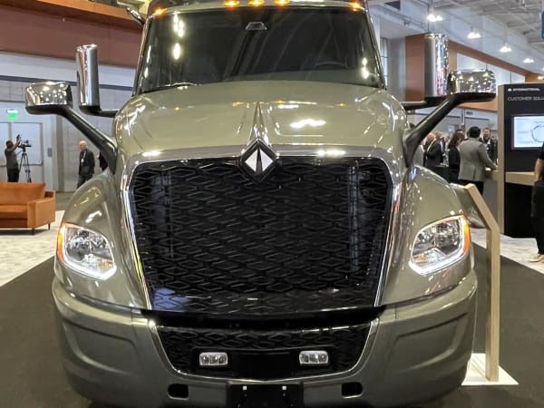 International semi truck head-on at booth