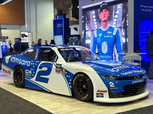 Blue and white racecar at show booth