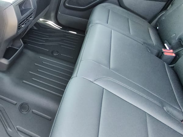View of the floor area in the back seat.