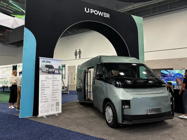 Small electric cargo van in a show floor display. 
