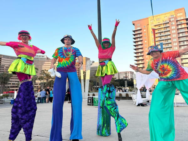 Colorful dancers during outdoor convention party. 