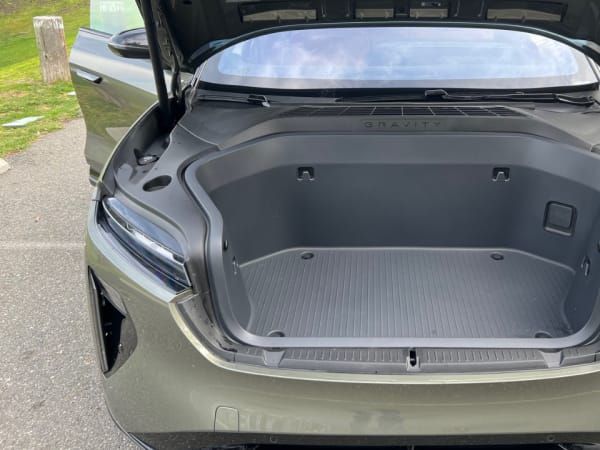Front frunk area with hood open.