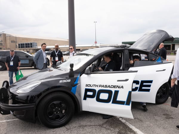 A Tesla Model 3 with a South Pasadena Police decal is shown.