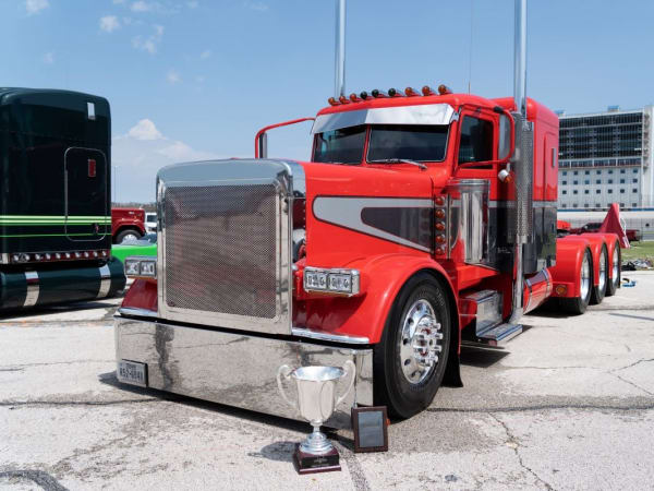 A red 2019 Peterbilt Model 390.