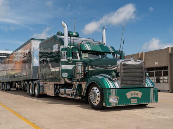 Green 1996 Freightliner Classic XL tractor-trailer. 