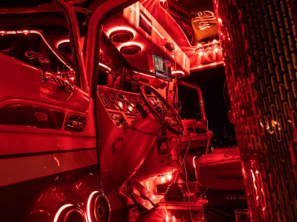 2019 Peterbilt Model 389 cab lit up at night.