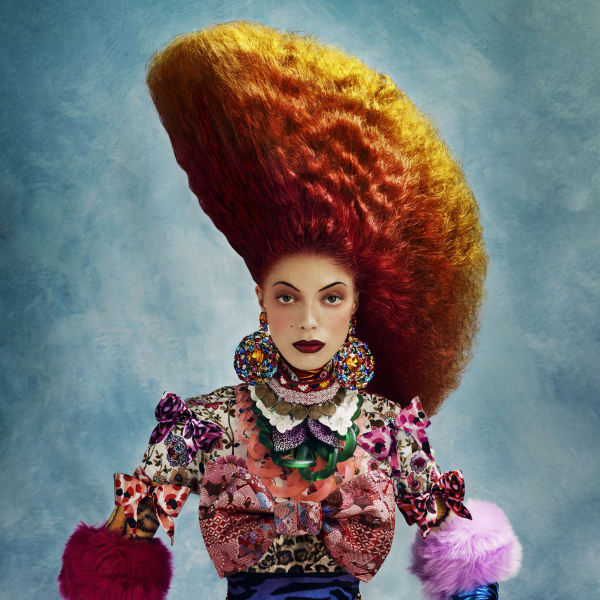 A woman in colorful hair and clothes.