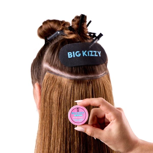 Model demonstrating the one sided tape roll in hair