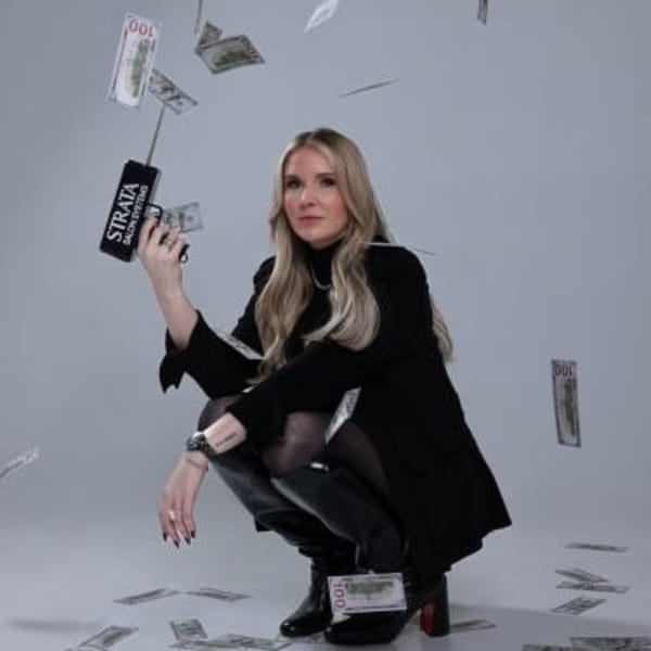 Woman shooting money from a money gun