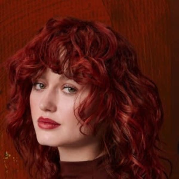 A red headed woman and a brunette woman