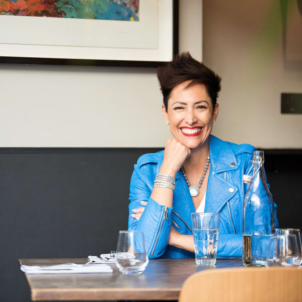 A smiling woman at a desk