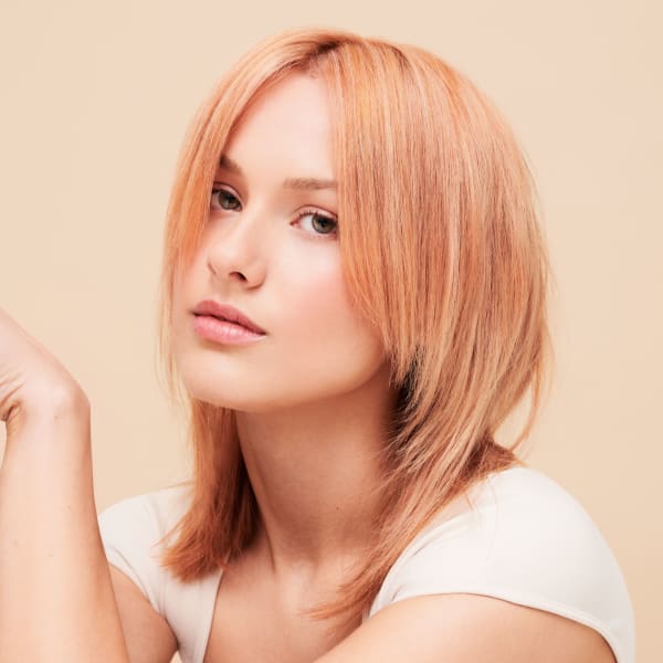 A woman with peach-colored hair.