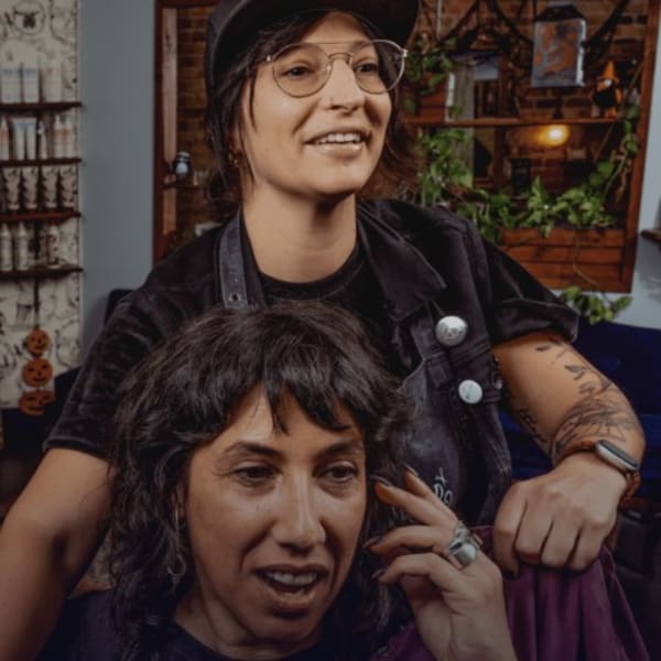 Hair Has No Gender is the nonprofit founded by Chicago stylist and salon owner, Jamie DiGrazia, shown here with a client.