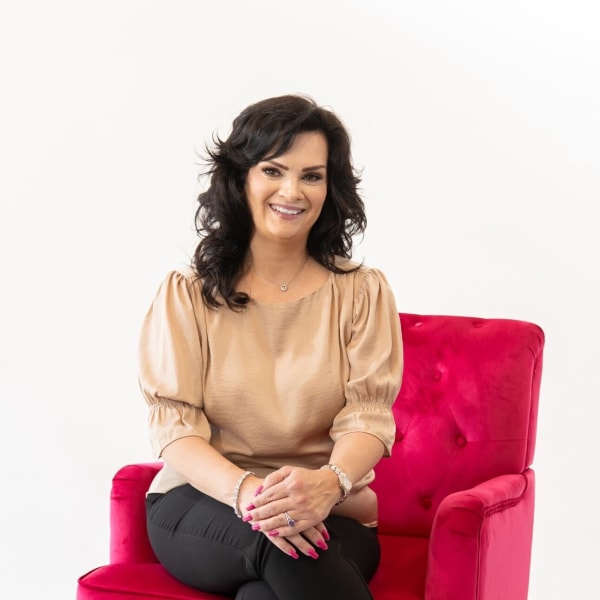 Woman sitting in a red chair