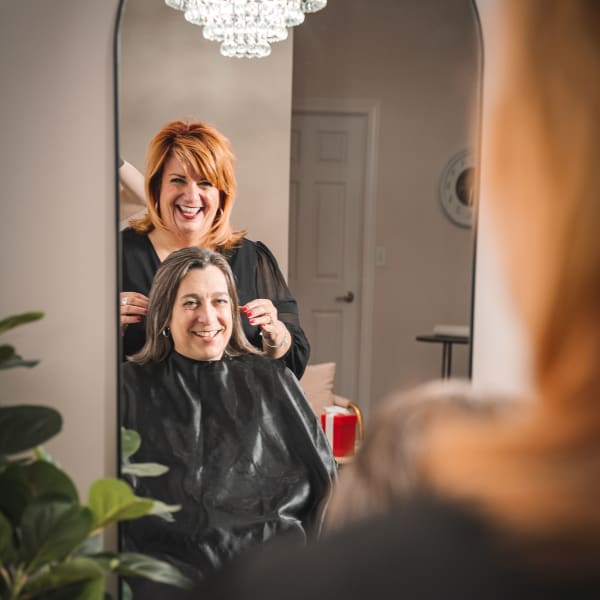 A hairstylist and a salon client