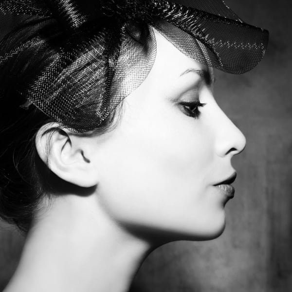 A youthful female model in profile.