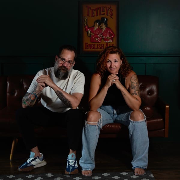 A man and a woman sitting on a couch