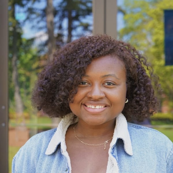 A young woman with curly hair