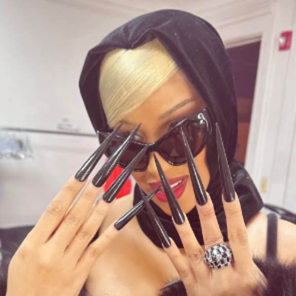 Woman with very long nails.
