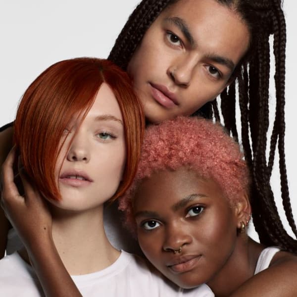 Three models with beautiful hair color and haircuts.