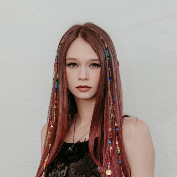 A young woman with long hair.