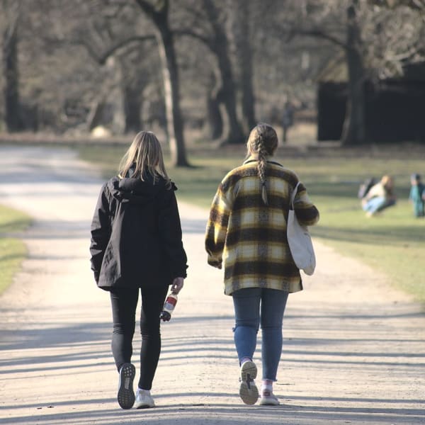 Two women walking.